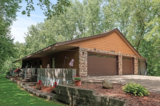 view of property exterior featuring a garage