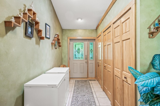 doorway to outside featuring light tile patterned flooring