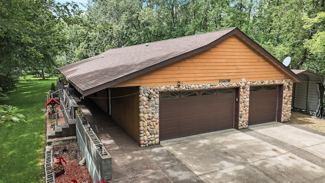 view of front of home with a garage and a front lawn