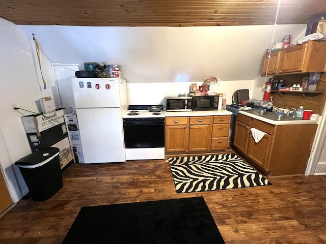 kitchen featuring dark wood-type flooring, sink, white fridge, and range with electric stovetop