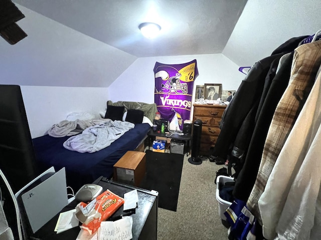 carpeted bedroom with vaulted ceiling