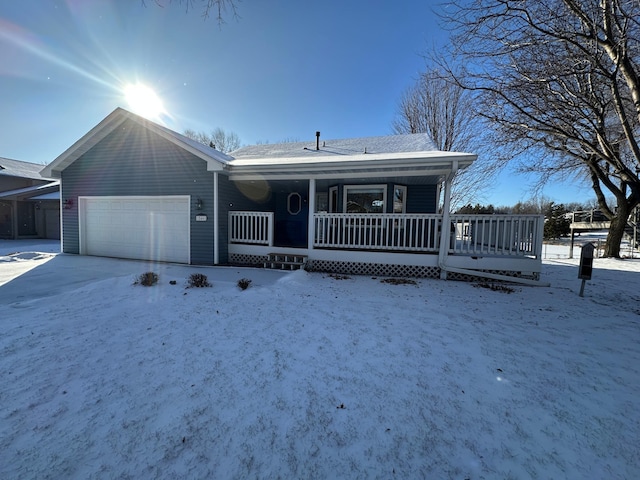 view of front of property with a garage and covered porch