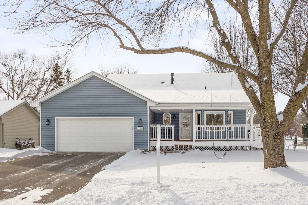 ranch-style home featuring a garage