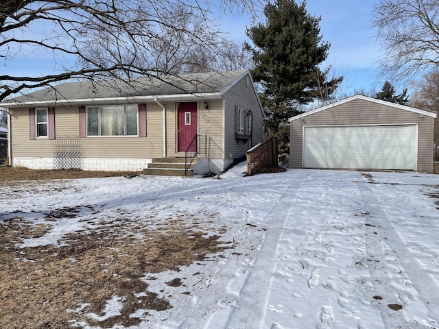 view of front of house featuring a garage and an outdoor structure