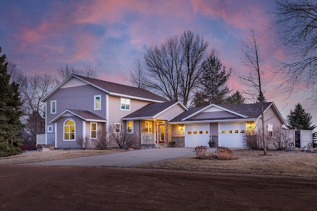 view of front of house featuring an attached garage and driveway