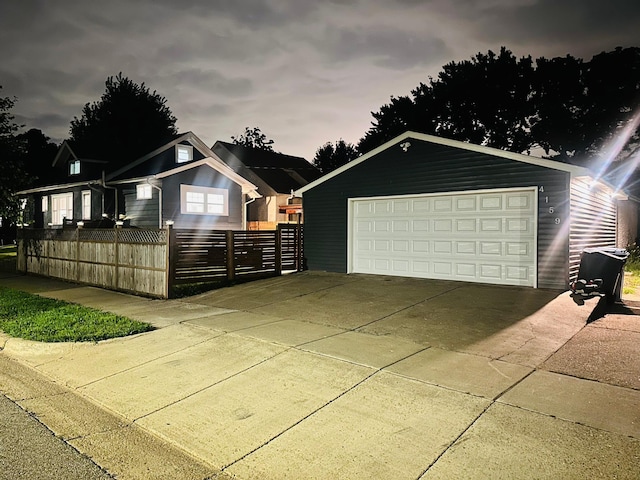 view of front facade featuring an outbuilding and a garage