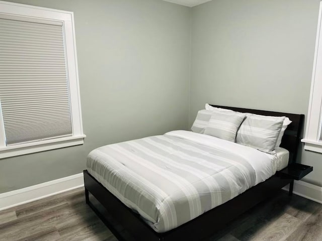 bedroom with hardwood / wood-style flooring