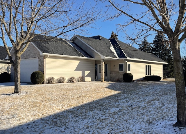 view of side of home with a garage