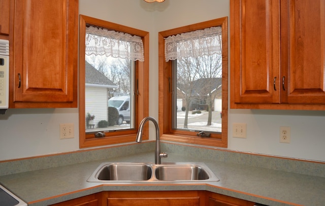 kitchen with a healthy amount of sunlight and sink