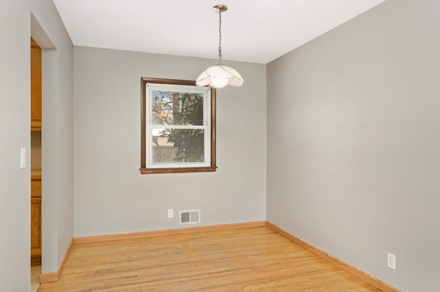 empty room with light hardwood / wood-style floors