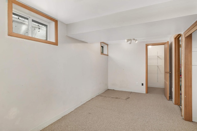 basement with light colored carpet