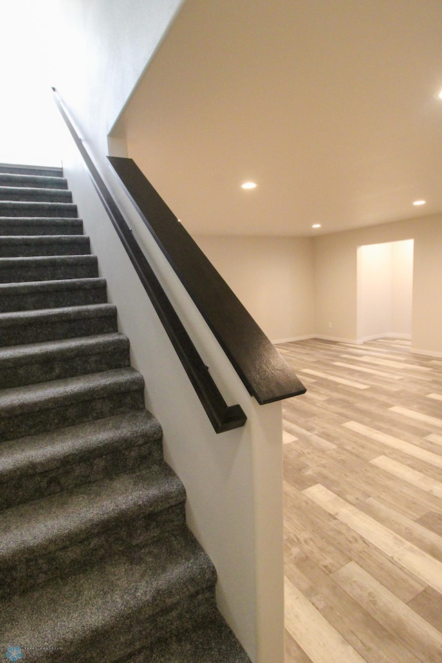 stairway featuring hardwood / wood-style flooring