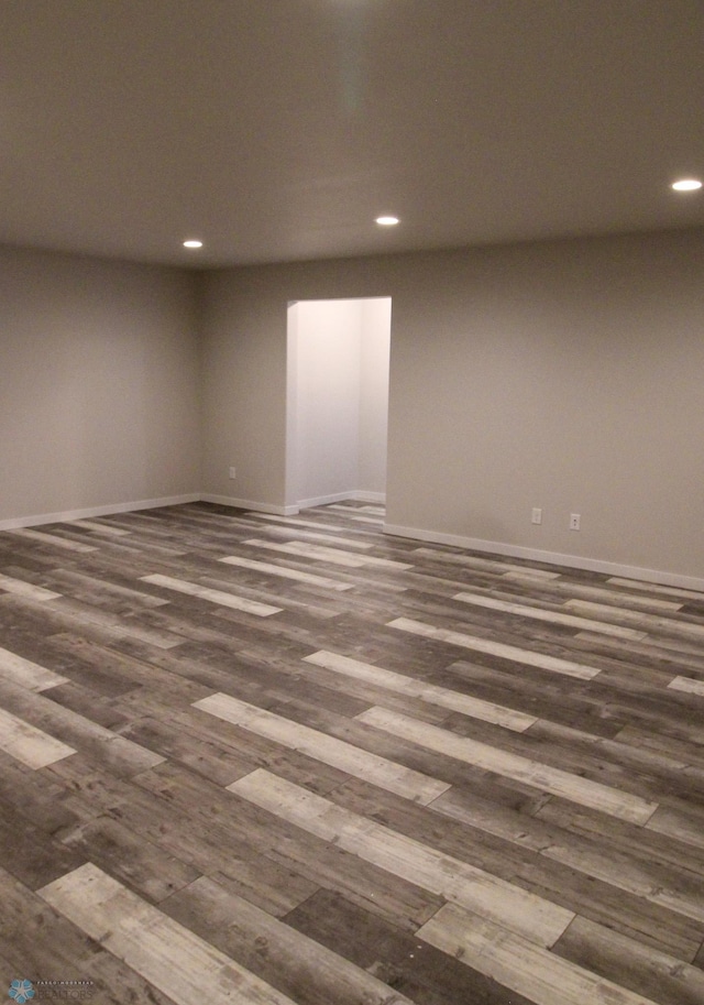 empty room featuring dark hardwood / wood-style flooring