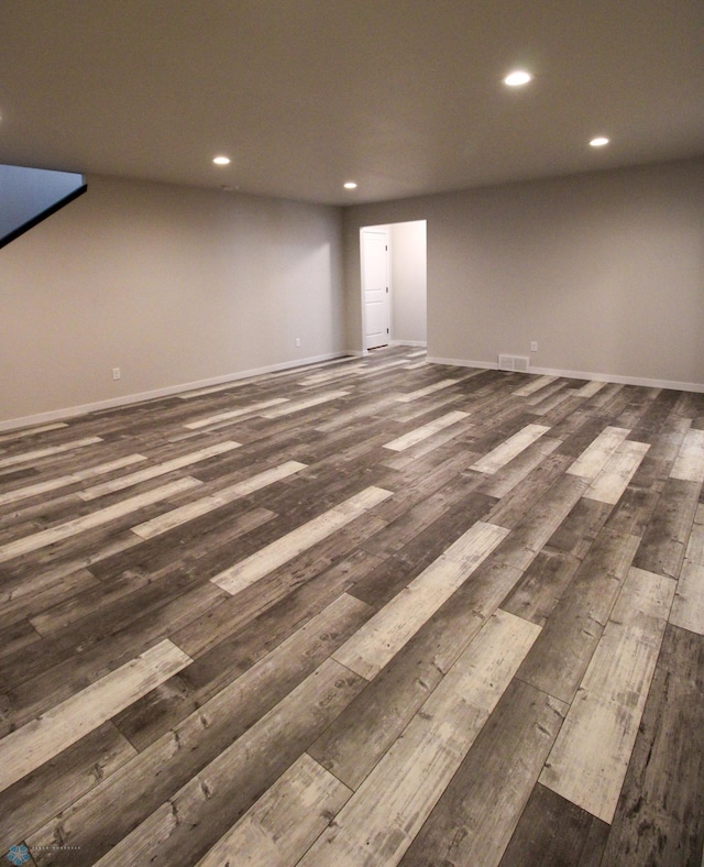 basement with dark wood-type flooring