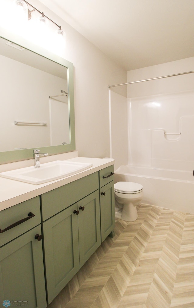 full bathroom with vanity, shower / bathing tub combination, and toilet