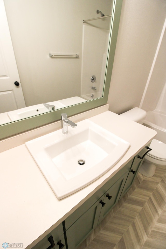 full bathroom featuring vanity, toilet, and shower / bathing tub combination