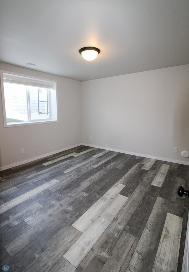 unfurnished room featuring dark hardwood / wood-style floors