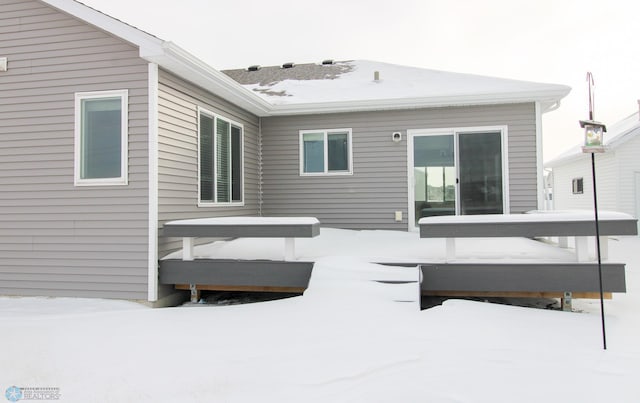 view of snow covered house