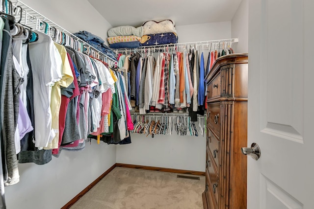 walk in closet with carpet floors and visible vents