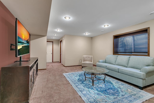 living area featuring recessed lighting, light carpet, and baseboards