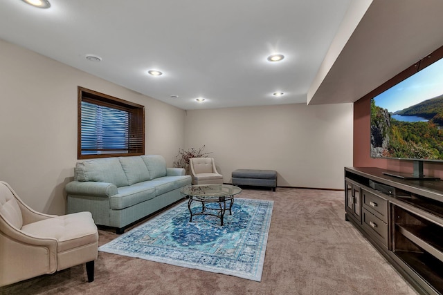 living area with light carpet, baseboards, and recessed lighting