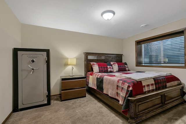 bedroom with carpet flooring and baseboards