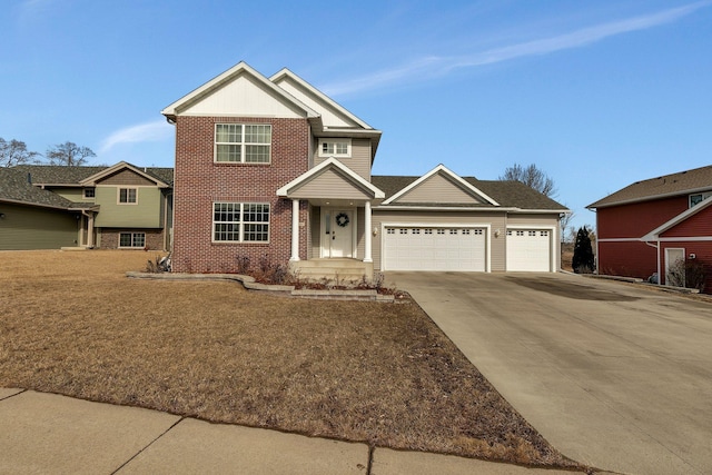 view of front of property with an attached garage, driveway, a front lawn, and brick siding