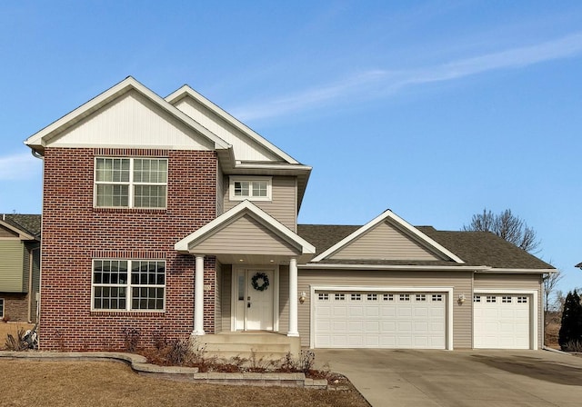 view of front of home with an attached garage, concrete driveway, and brick siding