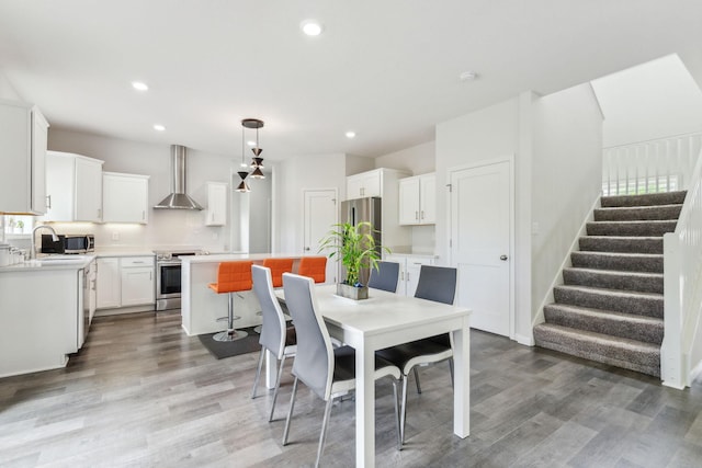 18338 Dove Ct, Eden Prairie, MN 55347 - dining area featuring dark wood-type flooring and sink