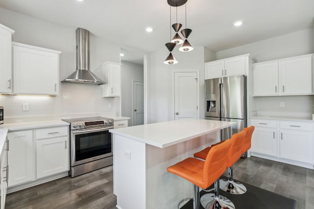 18338 Dove Ct, Eden Prairie, MN 55347 - kitchen with wall chimney range hood, stainless steel appliances, and white cabinets