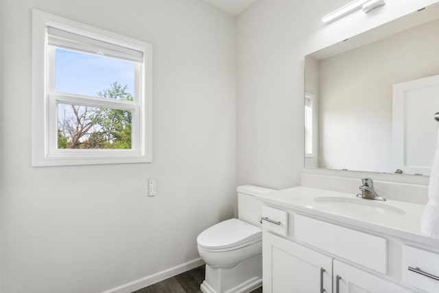 18338 Dove Ct, Eden Prairie, MN 55347 - bathroom with vanity, toilet, and wood-type flooring