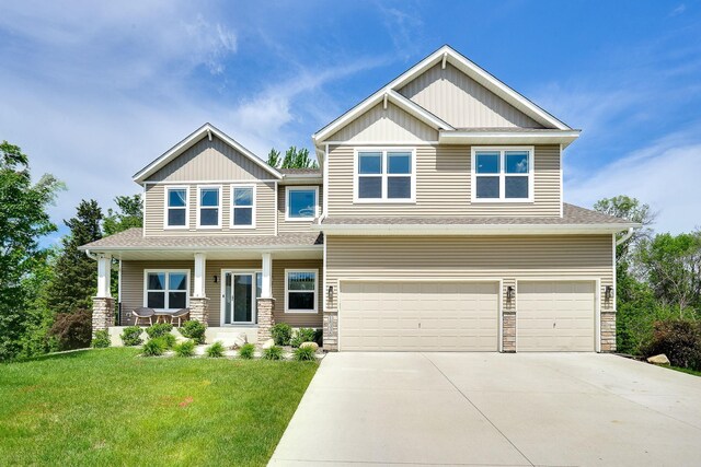 18338 Dove Ct, Eden Prairie, MN 55347 - craftsman house featuring a porch, a garage, and a front lawn