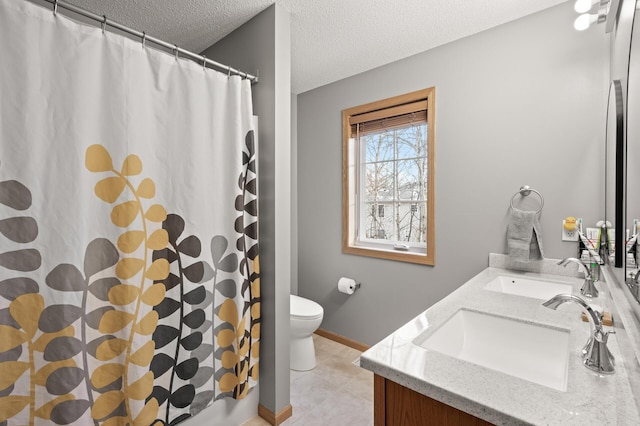 bathroom with vanity, a shower with shower curtain, a textured ceiling, and toilet