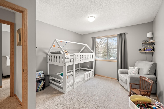 carpeted bedroom with a textured ceiling