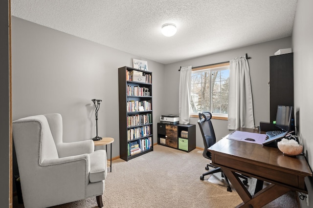 carpeted home office with a textured ceiling