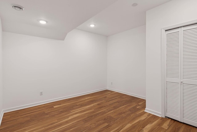 unfurnished room with hardwood / wood-style floors