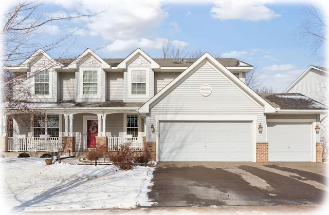 view of front of house with a garage and a porch