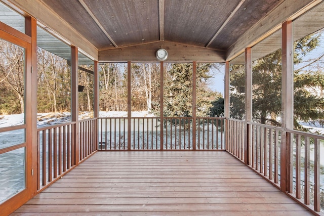 unfurnished sunroom with vaulted ceiling