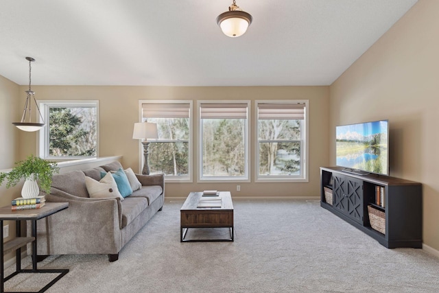 living room featuring light carpet and a wealth of natural light