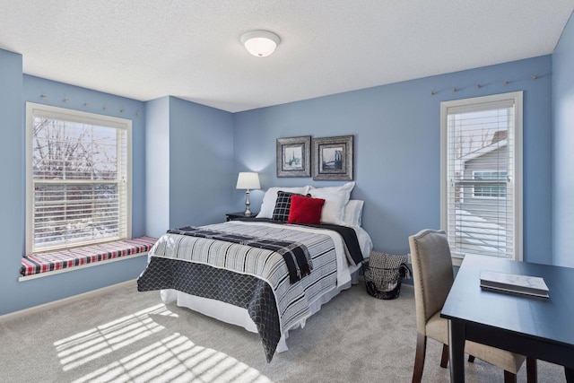 carpeted bedroom with a textured ceiling