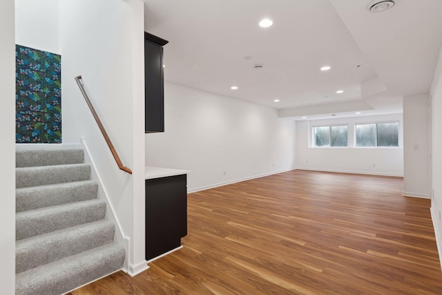 unfurnished living room with hardwood / wood-style flooring