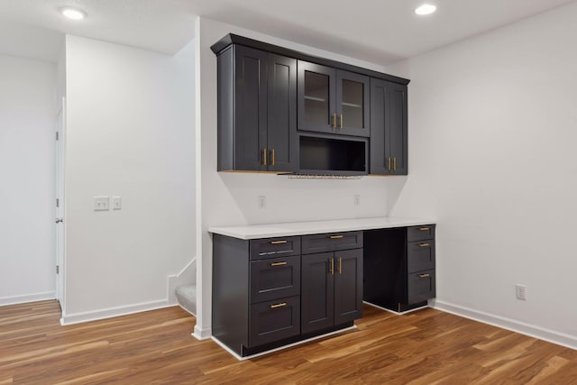 bar featuring dark hardwood / wood-style floors