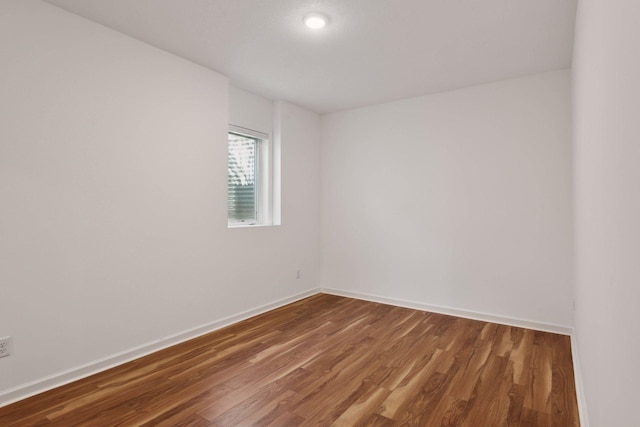 empty room with wood-type flooring