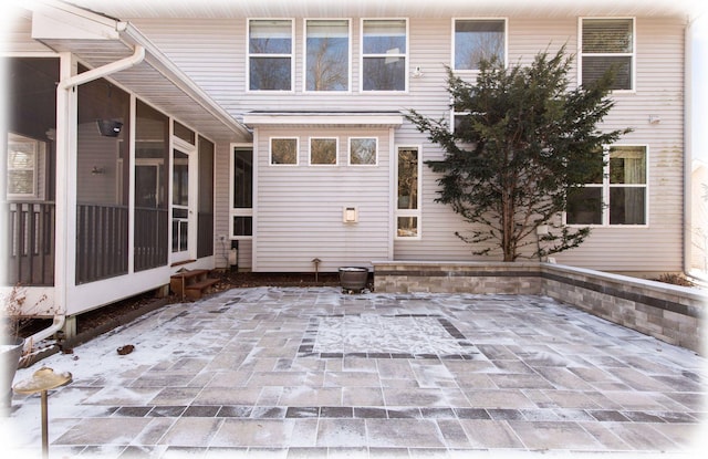 view of patio / terrace with a sunroom