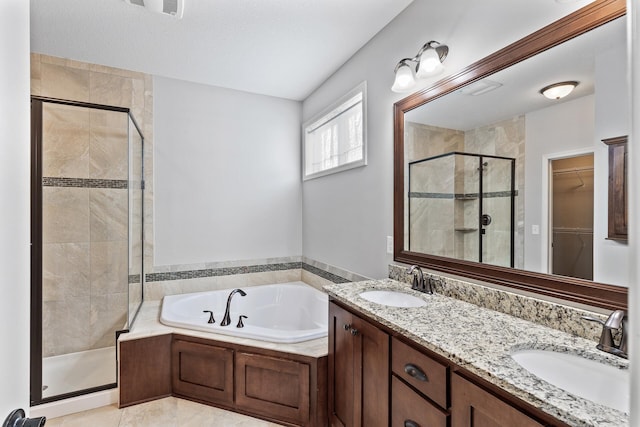 bathroom featuring vanity and separate shower and tub