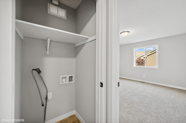 laundry area with hookup for a washing machine and light carpet