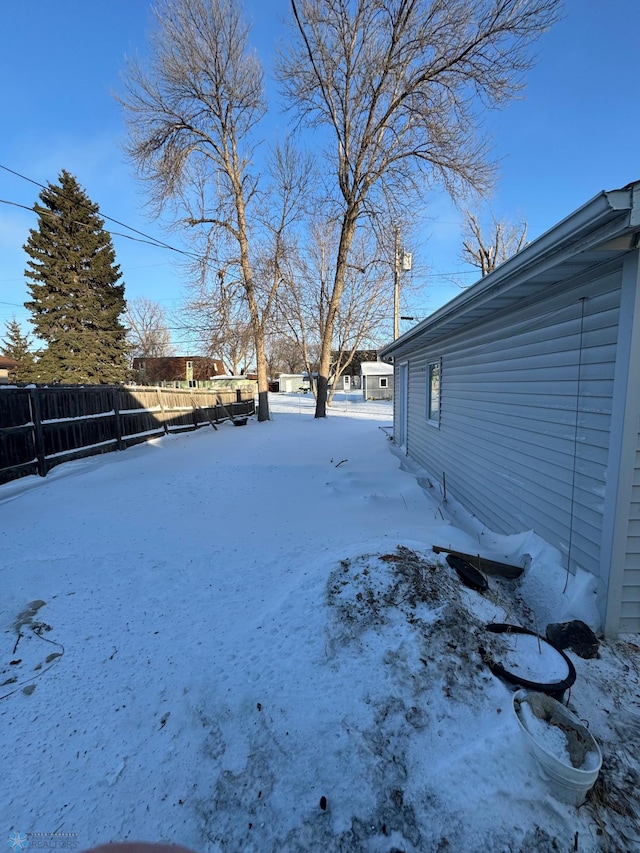 view of yard layered in snow