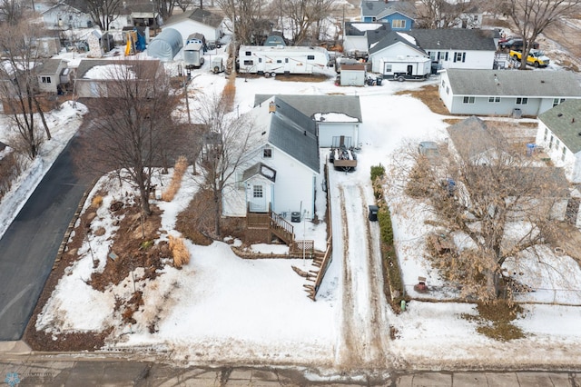 snowy aerial view featuring a residential view