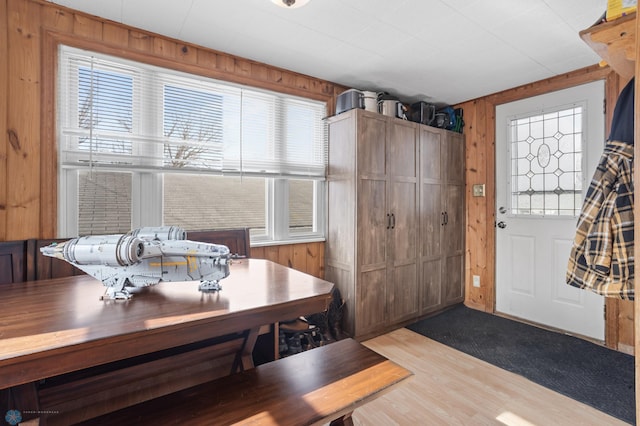 dining area with wood walls