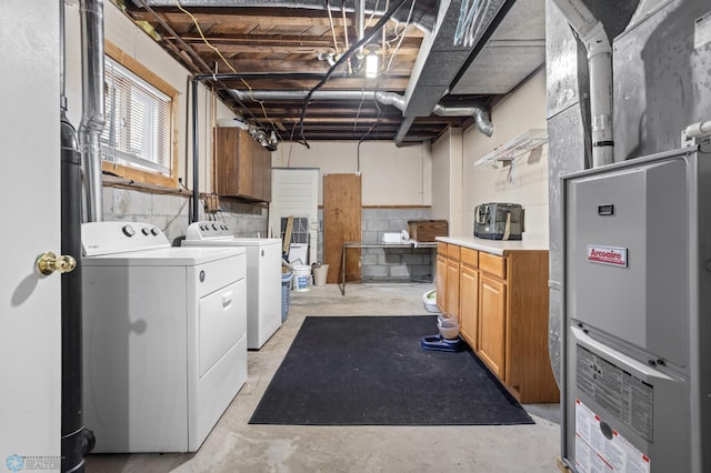 clothes washing area featuring laundry area and washing machine and clothes dryer